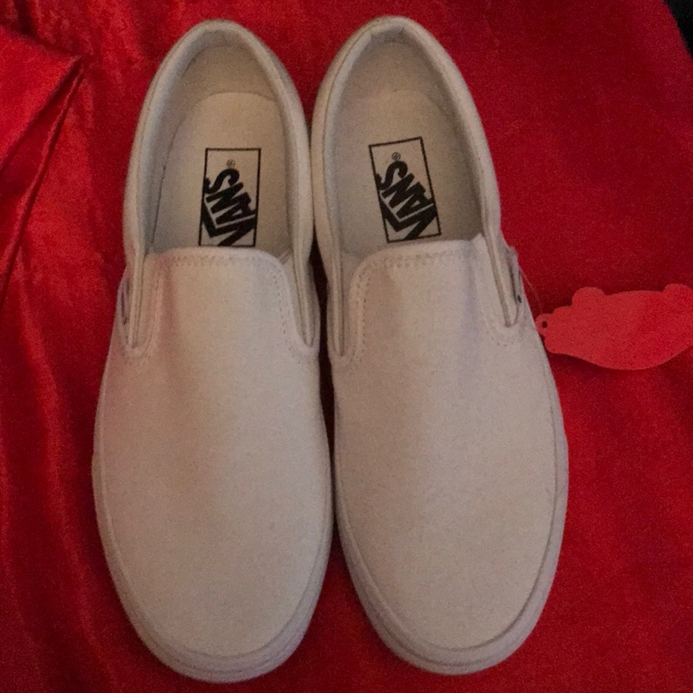 All white slip on vans